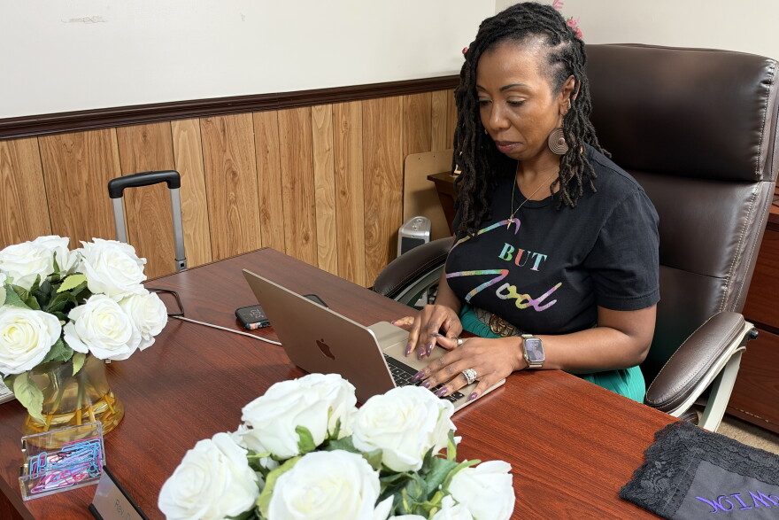 The Rev. Sha’Leda Mirra prepares to have a virtual meeting with a contractor about the church’s rebuilding.