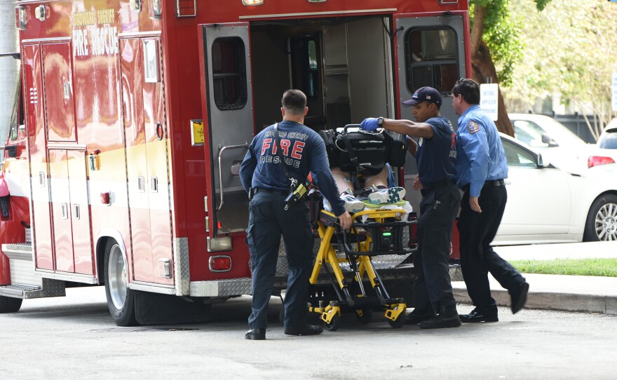A victim is taken into Broward Health Trauma Center in Fort Lauderdale, Fla., on Friday following a shooting at the Fort Lauderdale-Hollywood International Airport.