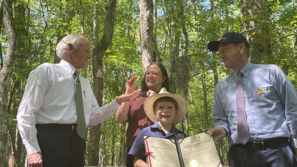 Gov. Henry McMaster; Jennifer McCarthey Tyrrell, community science and research program manager at Audubon South Carolina; Jack Ragley; and S.C. Sen. Tom Davis, R-Beaufort, celebrate on Monday, April 20, 2026, at the Francis Beidler Forest a ceremonial bill signing designating the Prothonotary Warbler as South Carolina's state migratory bird.