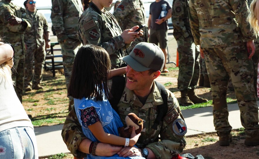 An airman reunites with his daughter.