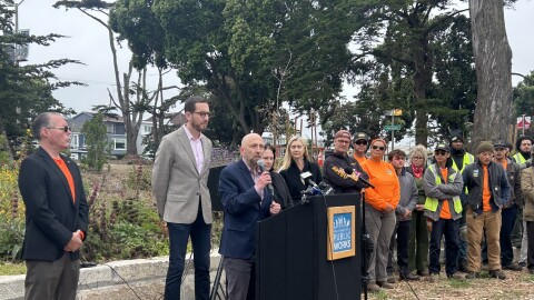 Joel Engardio addresses a crowd in the Sunset announcing new funding.
