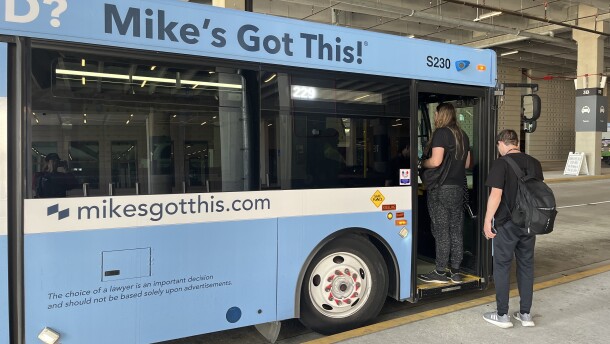 Riders board the 229 bus at MCI's terminal.