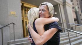 Sexual assault survivors Amy Yoney, right, and Laurie Kanyok, left, embrace after speaking to members of the media during a break in sentencing proceedings for convicted sex offender Robert Hadden outside Federal Court in New York. The former obstetrician was convicted of sexually abusing multiple patients over several decades. (John Minchillo/AP)