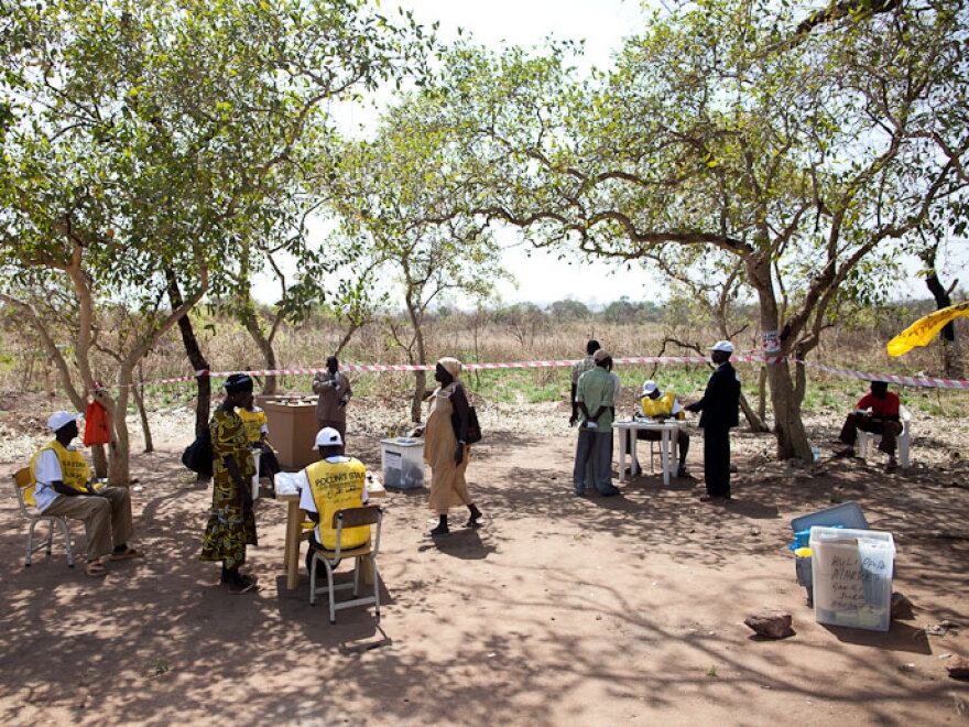 Voters arrive Sunday at the polling station in Kuli Papa, a village outside the Southern Sudan capital of Juba.