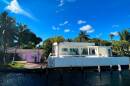 Two next-door homes along the Miami River 