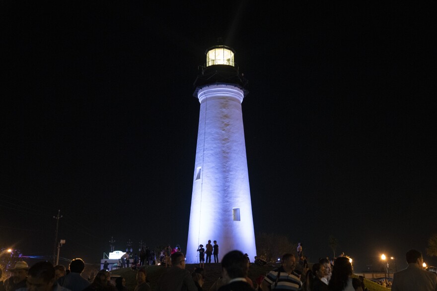 People gathered after the dedication ceremony of a Third Order Fresnel Lens at the Port Isabel Lighthouse Historic Site in Port Isabel on Friday. The lens was relit after 117 years. The Texas Historical Commission and the Port Isabel Lighthouse State Historic Site obtained a new lens for the lighthouse. 