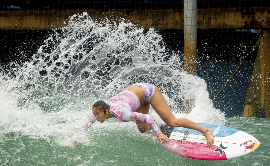 Carissa Moore of the United States, practices for a World Surf League competition at Surf Ranch on Wednesday, June 16, 2021, in Lemoore, Calif. The Summer Games in Tokyo, which kick off this month, serve as a proxy for that unresolved tension and resentment, according to the Native Hawaiians who lament that surfing and their identity have been culturally appropriated by white outsiders who now stand to benefit the most from the $10 billion industry. (AP Photo/Noah Berger)