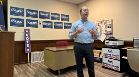 Ethan Corson speaks in the Crawford County Democrats' office. He's standing in front of a wall, which has his campaign signs on it.
