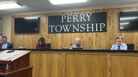 Perry Township trustees Matt Miller, Lisa Nelligan and Ralph DeChiara Jr. and law director James Mathews