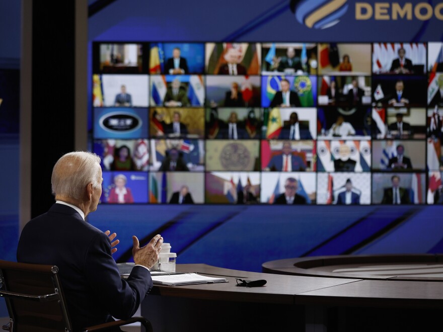 President Biden spoke to participants in the Summit for Democracy from a soundstage that the White House has set up for such virtual events.