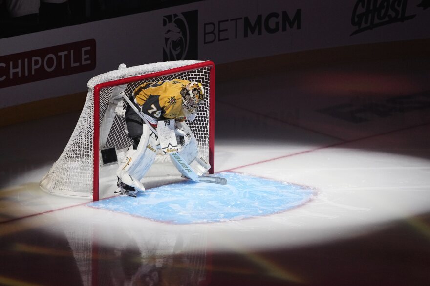 Vegas Golden Knights goaltender Carter Hart pauses at the net before Game 6 of the NHL hockey Stanley Cup Final series against the Carolina Hurricanes, Sunday, June 14, 2026, in Las Vegas. (AP Photo/Candice Ward)