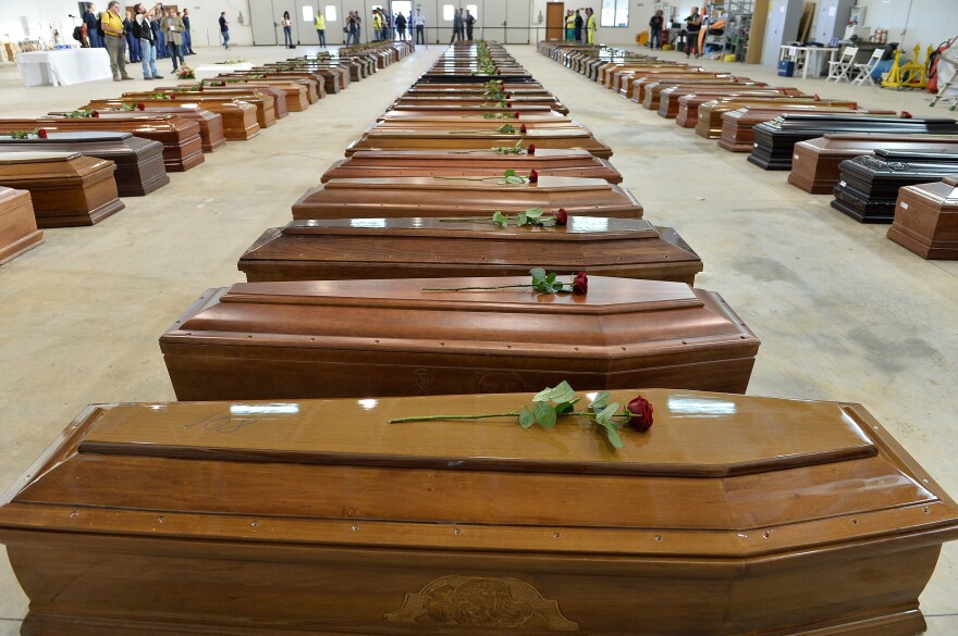 Some 300 people died off the island of Lampedusa in a shipwreck southern Italy in 2013. Here, their coffins fill a large room as they wait to be moved.