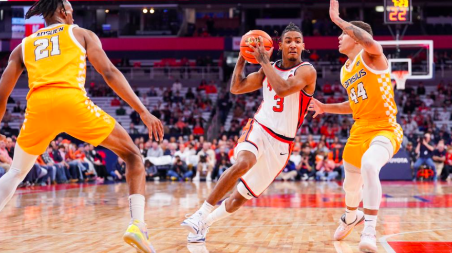 Judah Mintz (3, white) drives the lane in SU's win over Canisius.