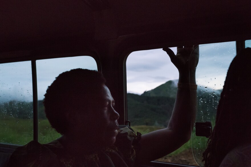 Ato Boropi looks out the window of a police car on her way back to Goroka after the reconciliation meeting in Henganofi. "I saw something was wrong" at the meeting, she says. "But because all the eyes were on me, I felt it was not easy to tell."