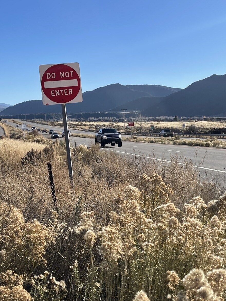 A collection of cars traverse along Highway 82