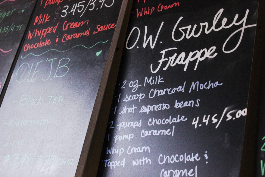 The coffee shop’s chalkboard menu displays the O.W. Gurley Frappe, named after the pioneer founder of Greenwood. Using unique flavors like charcoal mocha, Black Wall Street Liquid Lounge offers several one-of-a-kind specialty drinks.