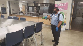 A custodian at Schertz-Cibolor-Universal City cleans a school cafeteria using a new tool purchased to enhance sanitazation during the coronavirus pandemic.