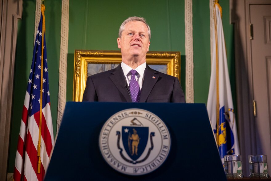 Massachusetts Gov Charlie Baker at a lecturn