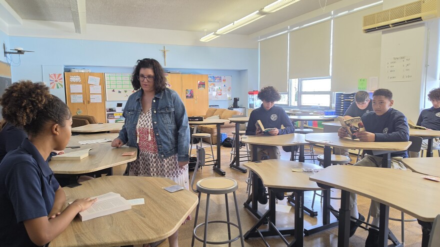 Saint John Neumann teacher Terra Thomke works her students in class on Thursday.