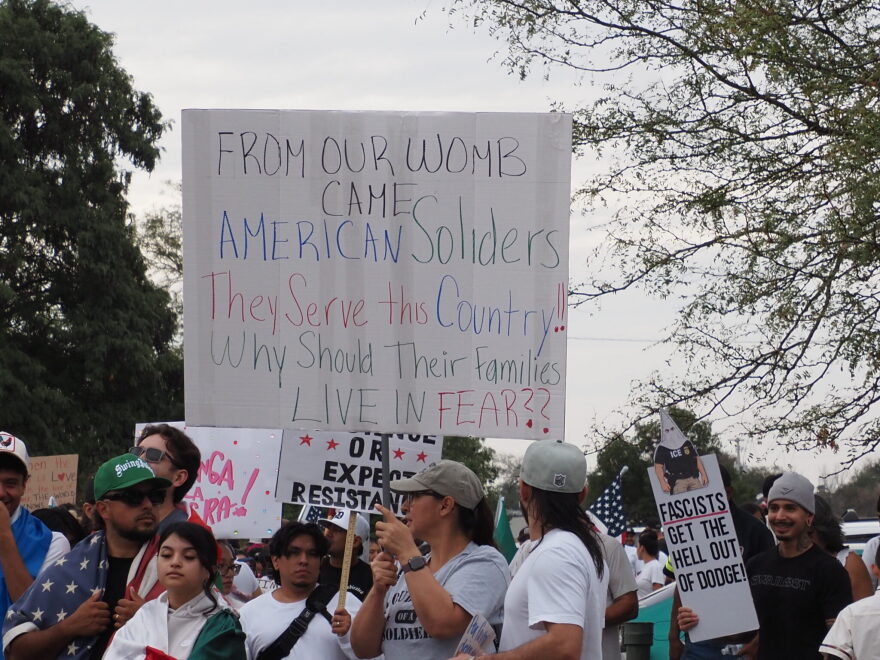 Dodge City protesters gather at Wright Park on Sept. 25, 2026, to march to U.S. Rep. Tracey Mann's office. They were protesting U.S. Immigration and Customs Enforcement actions in the community. 