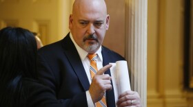 Del. Todd Gilbert, R-Shenandoah, talks with a colleague during the House session at the Capitol Wednesday, Feb. 26, 2020, in Richmond, Va. (AP Photo/Steve Helber)