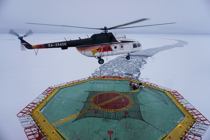 A helicopter takes off from the research vessel Akademik Federov to survey the thickness of an ice floe on Sept. 30.