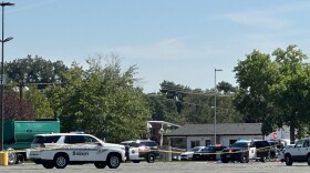 Police cars from the Washoe County Sheriff’s office, Reno and Sparks Police Departments block areas of the Grand Sierra Resort and Casino.