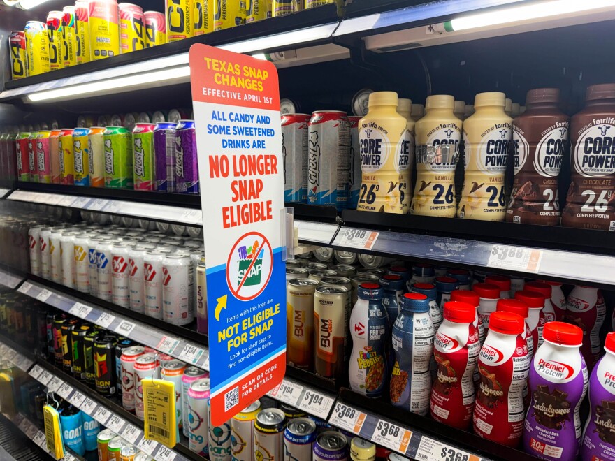 A sign at the H-E-B on University Boulevard in Round Rock warns customers that some items, including candy and sweetened drinks, are no longer eligible for SNAP purchases.
