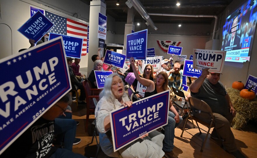 Supporters of former President Donald Trump gathered at Luzerne County Republican headquarters in Kingston react before Tuesday night's debate.