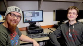 Butler University students Mathew O'Hern, left, and Parker Winters, right, are developing a video game to assist children with autism improve social skills.