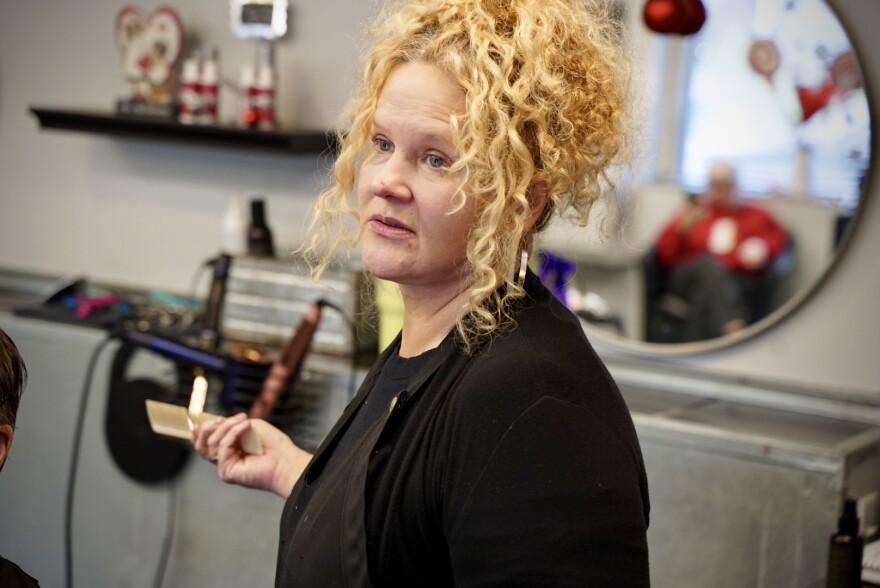 Michelle Cope stands in a salon.