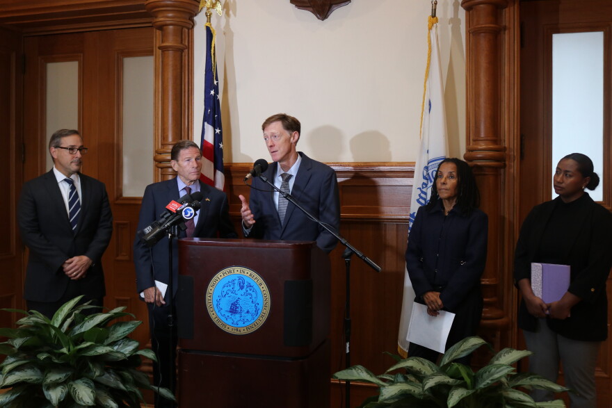 New Haven Mayor Justin Elicker (D) speaks alongside officials and advocates on Monday morning.