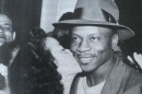 Willard Brown, Louisiana-born baseball player and fourth Black player ever to play in the Major Leagues, receives a kiss at the Governor's Mansion in Puerto Rico, 1951