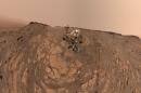 This selfie was taken by NASA's Curiosity Mars rover on Feb. 26, 2020 (the 2,687th Martian day, or sol, of the mission). The crumbling rock layer at the top of the image is the Greenheugh Pediment, which Curiosity climbed soon after taking the image. Directly to the left of Curiosity's foremost wheel is a hole the rover drilled at a rock feature called "Hutton." The selfie includes 86 individual images taken by the Mars Hand Lens Imager (MAHLI) camera on the end of Curiosity's robotic arm. The images were then stitched into a panorama.