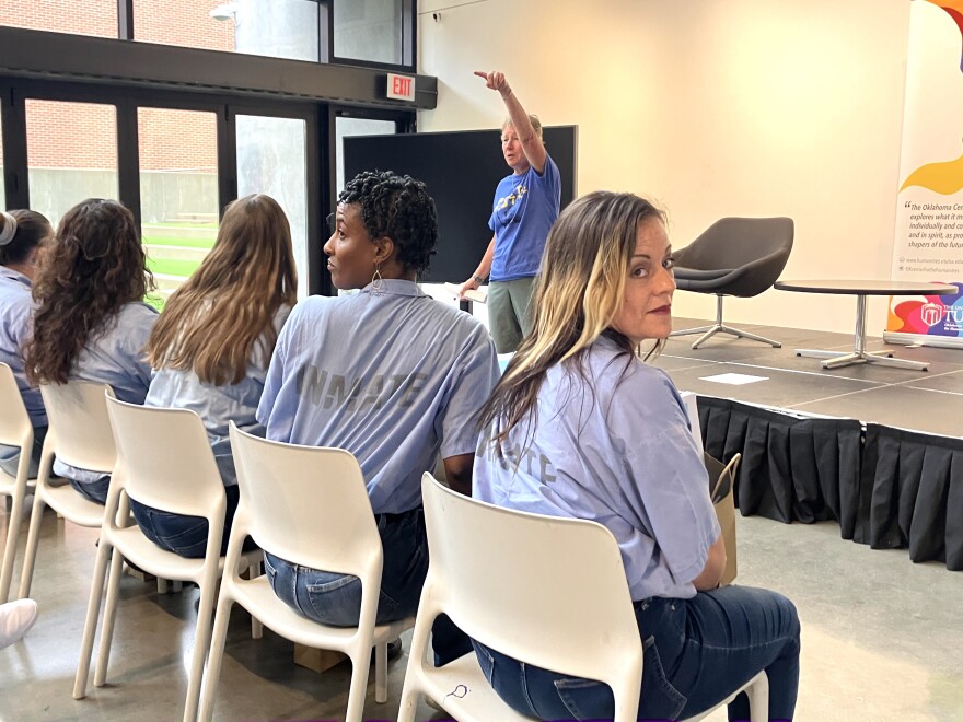 Amy Smith (far right) prepares to listen to a panel meant to help incarcerated women get on their feet after prison.