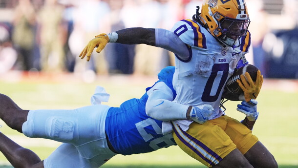 FILE - LSU wide receiver Zavion Thomas (0) is tackled by Mississippi linebacker Tahj Chambers (26) during the second half of an NCAA college football game in Oxford, Miss., Sept. 27, 2025. (AP Photo/Rogelio V. Solis, File)