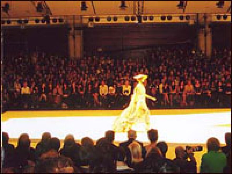 High fashion sweeps across the runway at a Paris fashion show in 2005.