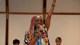 Woman sings on a stage