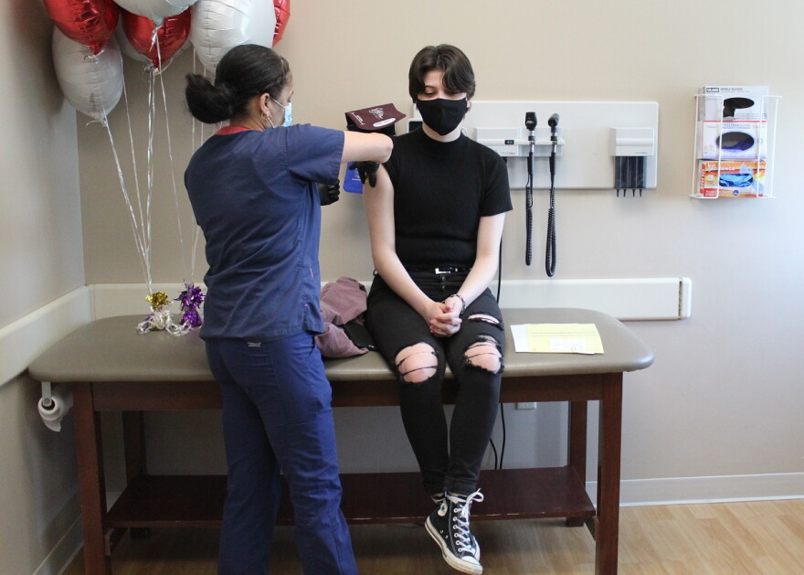 Shelby Morris, 17, of Clinton received the Carle Health's 100,000th dose at the Carle BroMenn Outpatient Center in Bloomington.