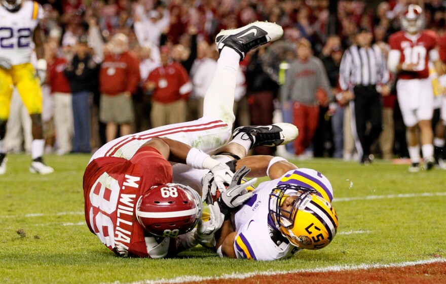 <strong>Not Giving An Inch:</strong> You can expect to see lots of close contact in Monday's BCS national title game. Here, Eric Reid of the LSU Tigers defends against Michael Williams of the Alabama Crimson Tide.