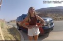 FILE - In this image taken from police body camera video provided by the Moab Police Department, Gabrielle "Gabby" Petito talks to a police officer after police pulled over the van she was traveling in with her boyfriend, Brian Laundrie, near the entrance to Arches National Park on Aug. 12, 2021. The families of Petito and Laundrie have reached a $3 million settlement in a wrongful death lawsuit filed after authorities concluded he strangled her during a cross-country trip in August 2021.