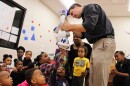 SIUE psychology professor Stephen Hupp lets a class of preschoolers at the Jackie Joyner-Kersee Center in East St. Louis touch a robot named Mo after a lesson on human emotions in March 2017.