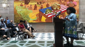 Stephanie Harris-Adkins addresses the crowd in City Hall at the Re-Entry Welcome Center opening ceremony. 