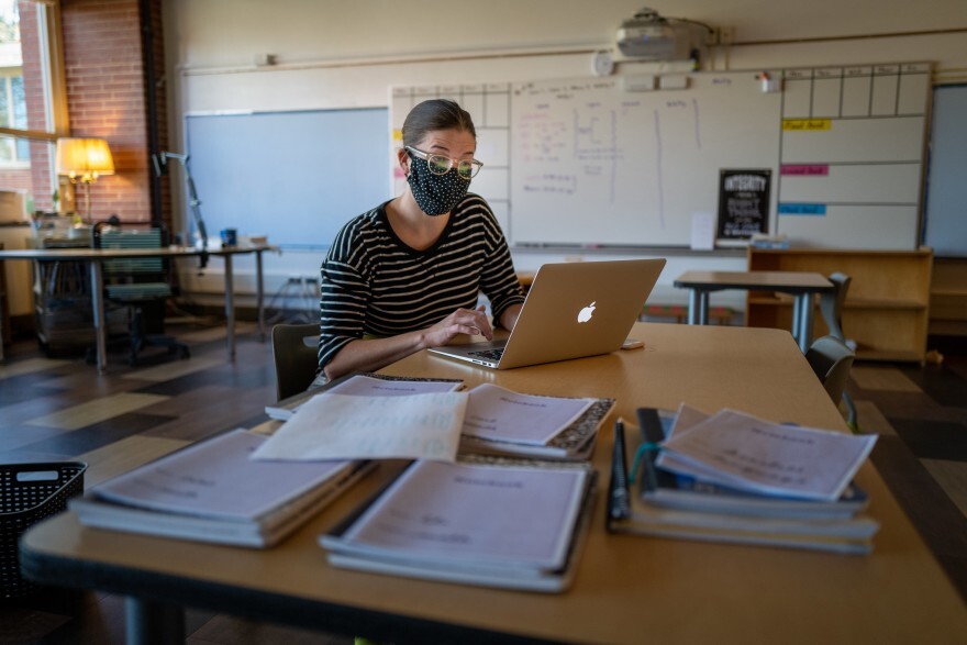 A teacher wears a mask inside a classroom. Both Gahunia and Ernst say new breakthrough COVID-19 cases among vaccinated people should not discourage people from getting the vaccinated. Credit: Phil Roeder/Flickr Creative Commons