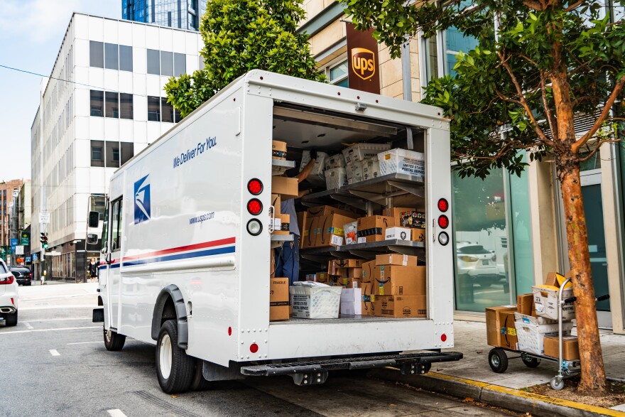 Postal workers are seeing tons of packages come in this holiday season.