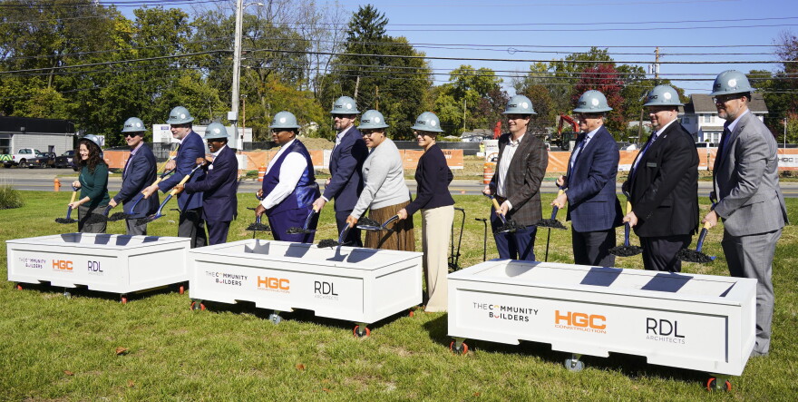 Members of the City of Bexley and The Community Builders break ground for new affordable housing development at an event.