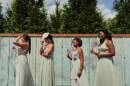 Bridesmaids wait to take photos on Aug. 23, 2025, in Newtown, Ohio. (Joshua A. Bickel/AP)