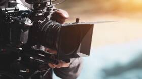 A filmmaker uses a camera. (Getty Images)