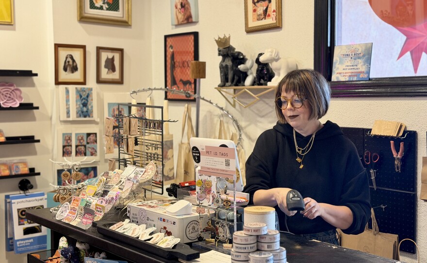 Nicole Millis, owner of Kiwis Distinguished Pet Goods, is pictured working at her shop on November 25, 2025.