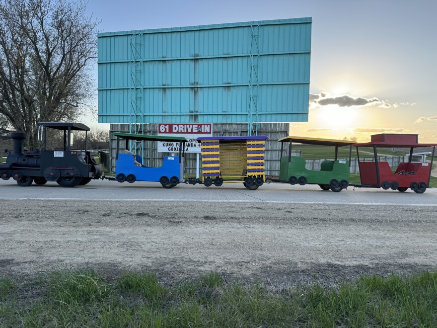 Voy 61 is Iowa's second-oldest drive-in theater. It's current owner, Dennis Voy, purchased it in 1972. It operates a free children's train along the grounds before showings.